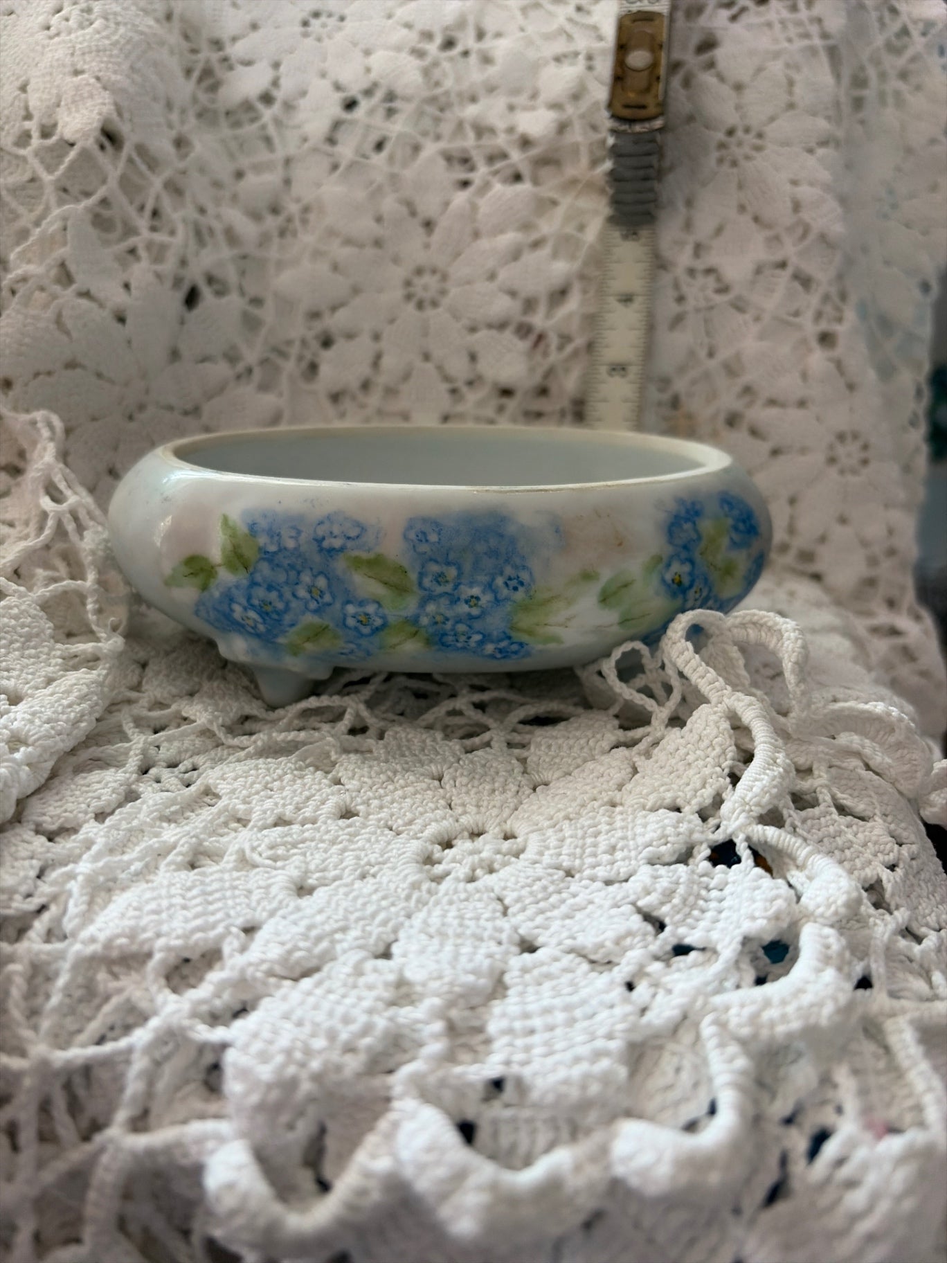 Small white ceramic oval dish with blue flowers