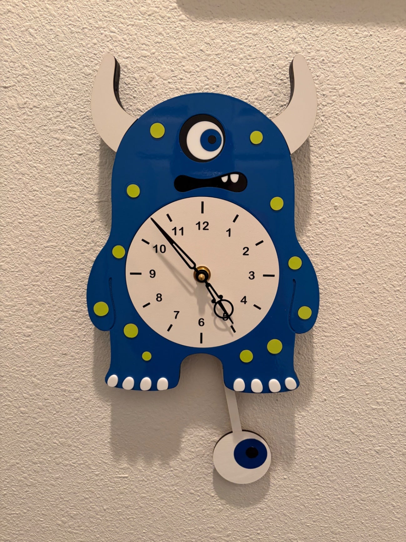 One eyed monster pendulum clock