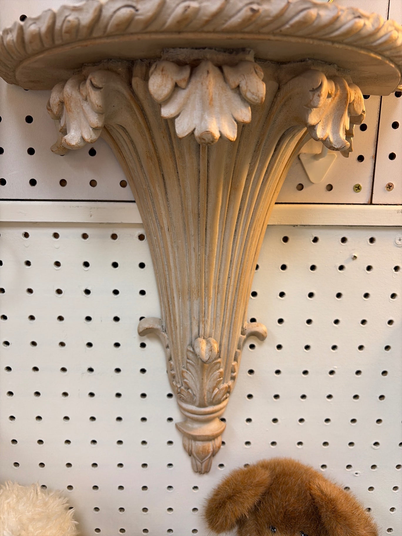 Ornate resin sconce.