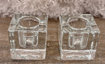 Pair of clear ice cube candle holders