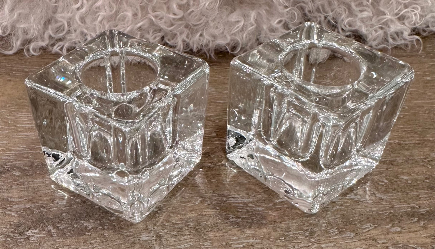 Pair of clear ice cube candle holders