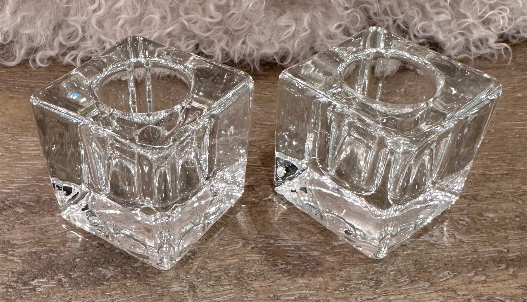 Pair of clear ice cube candle holders