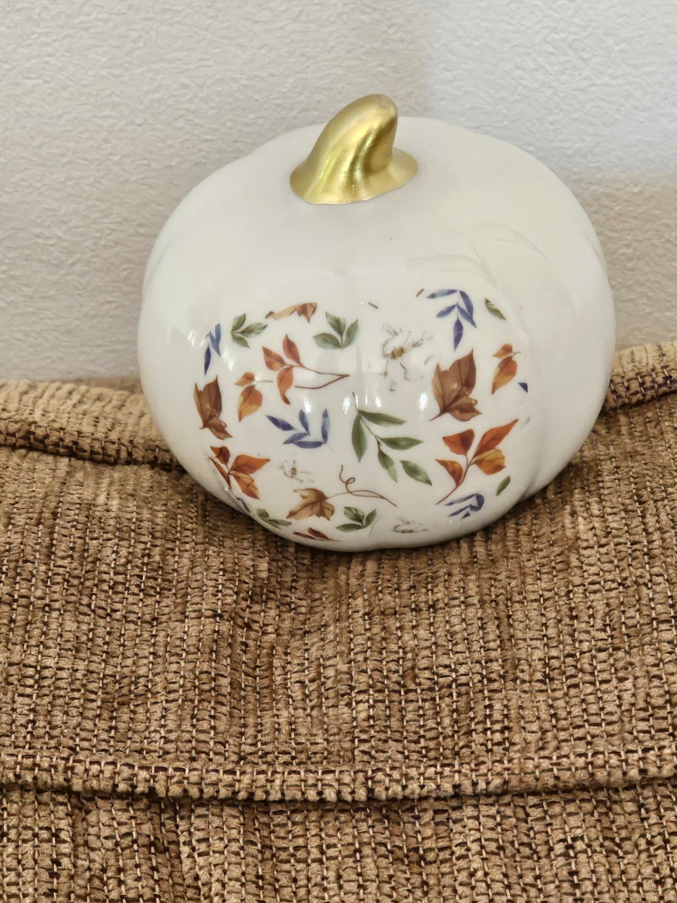 Small white ceramic pumpkin with deco and gold stem