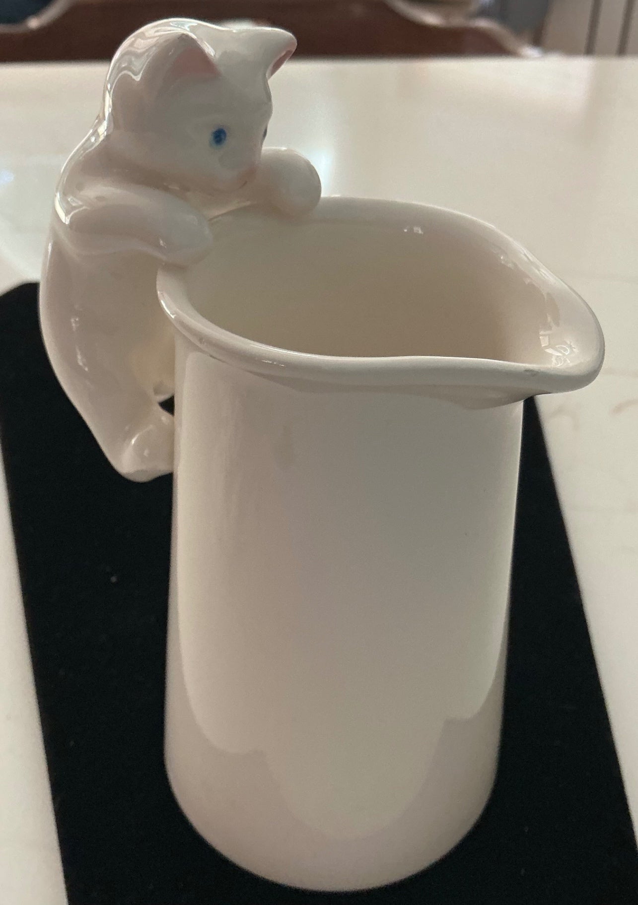Curious kitten creamer