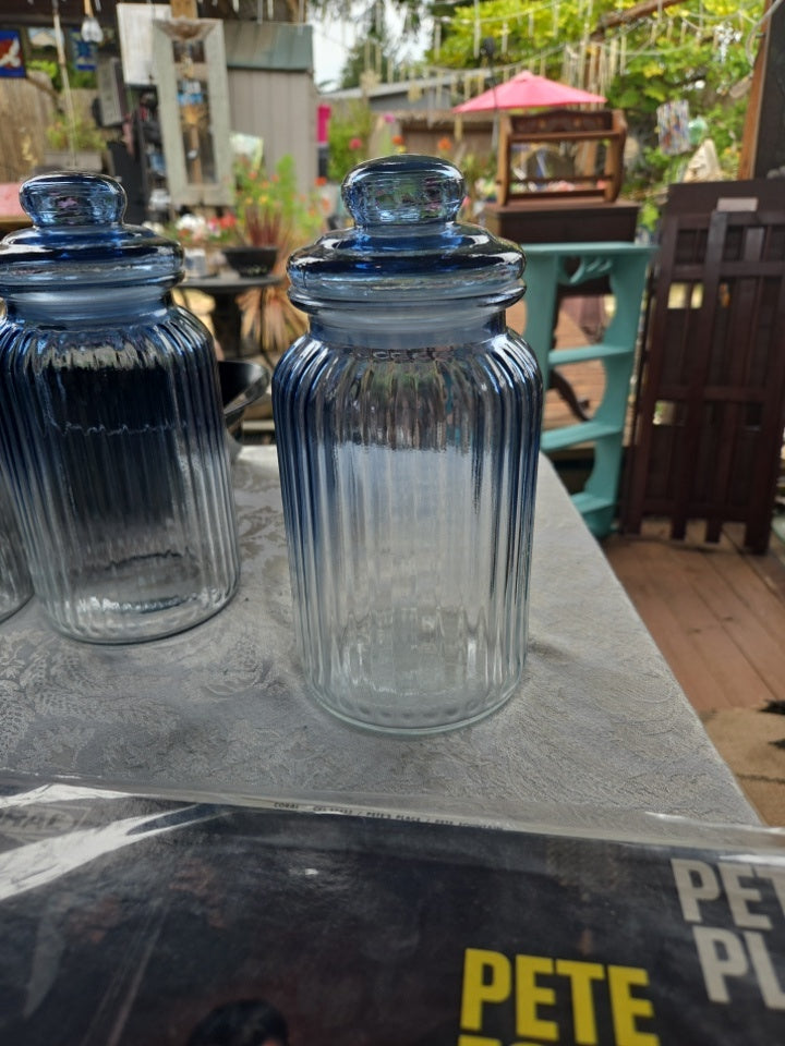 Blue ridged canister. Tight lid.