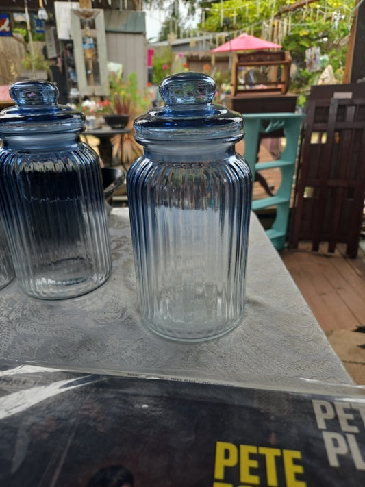 Blue ridged canister. Tight lid.