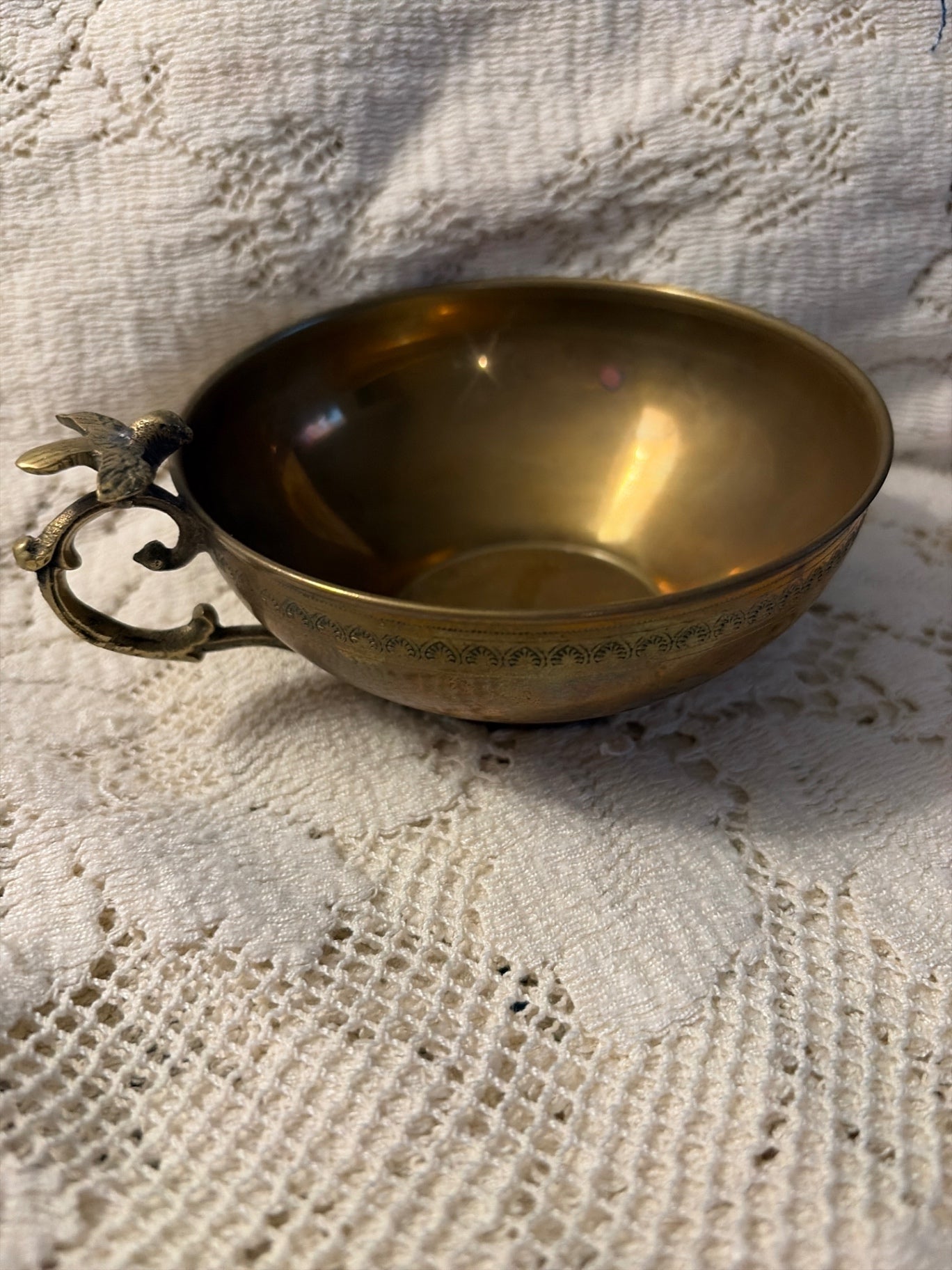 Vintage solid brass cup with bird on the handle