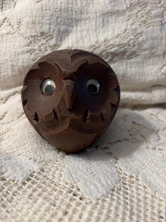 Round carved wooden owl