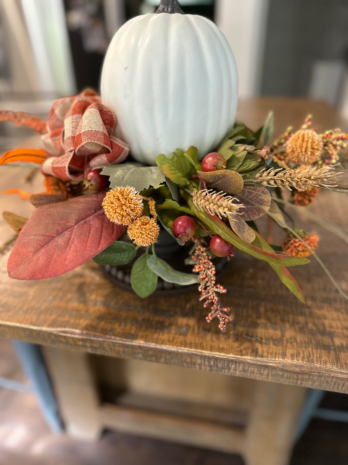 Floral centerpiece with white pumpkin