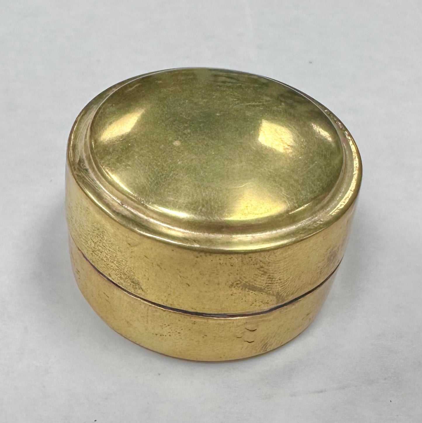 Tiny brass round pill box