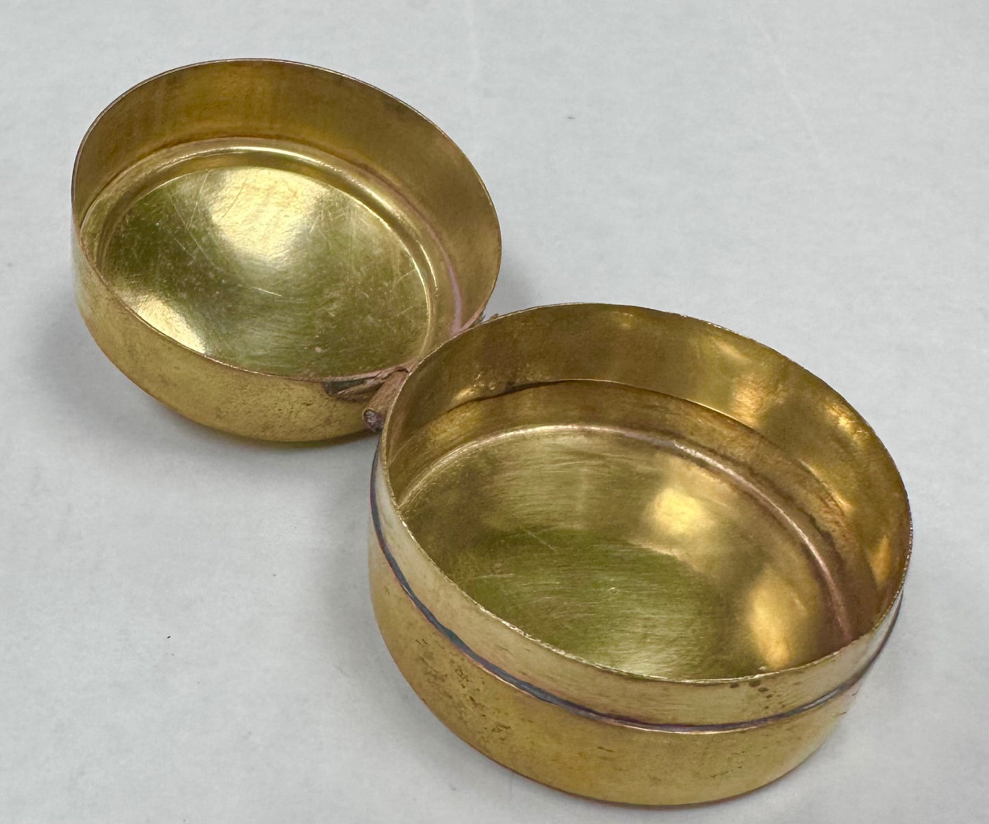 Tiny brass round pill box