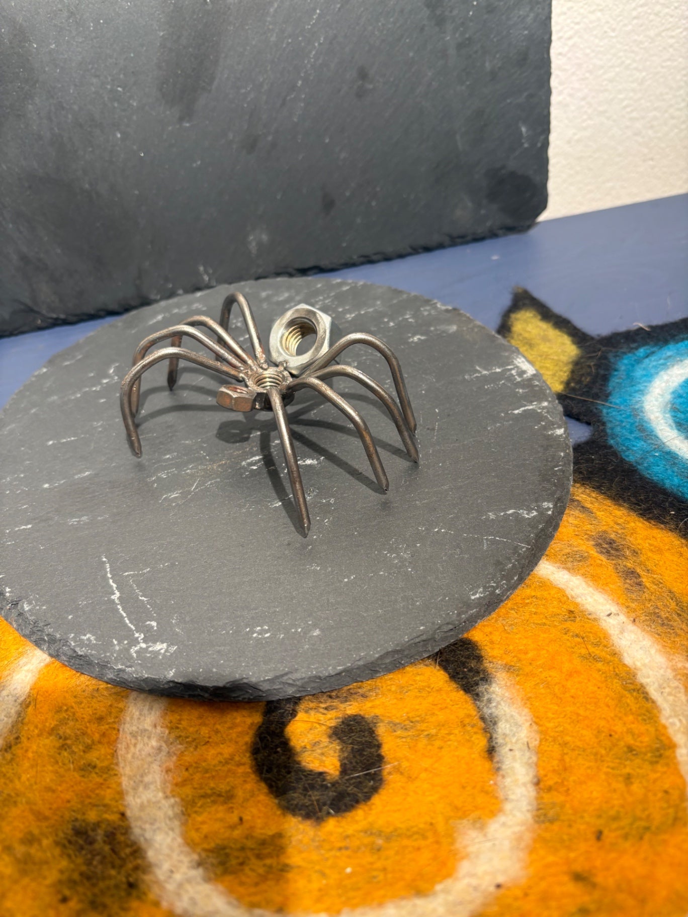 Welded metal spider