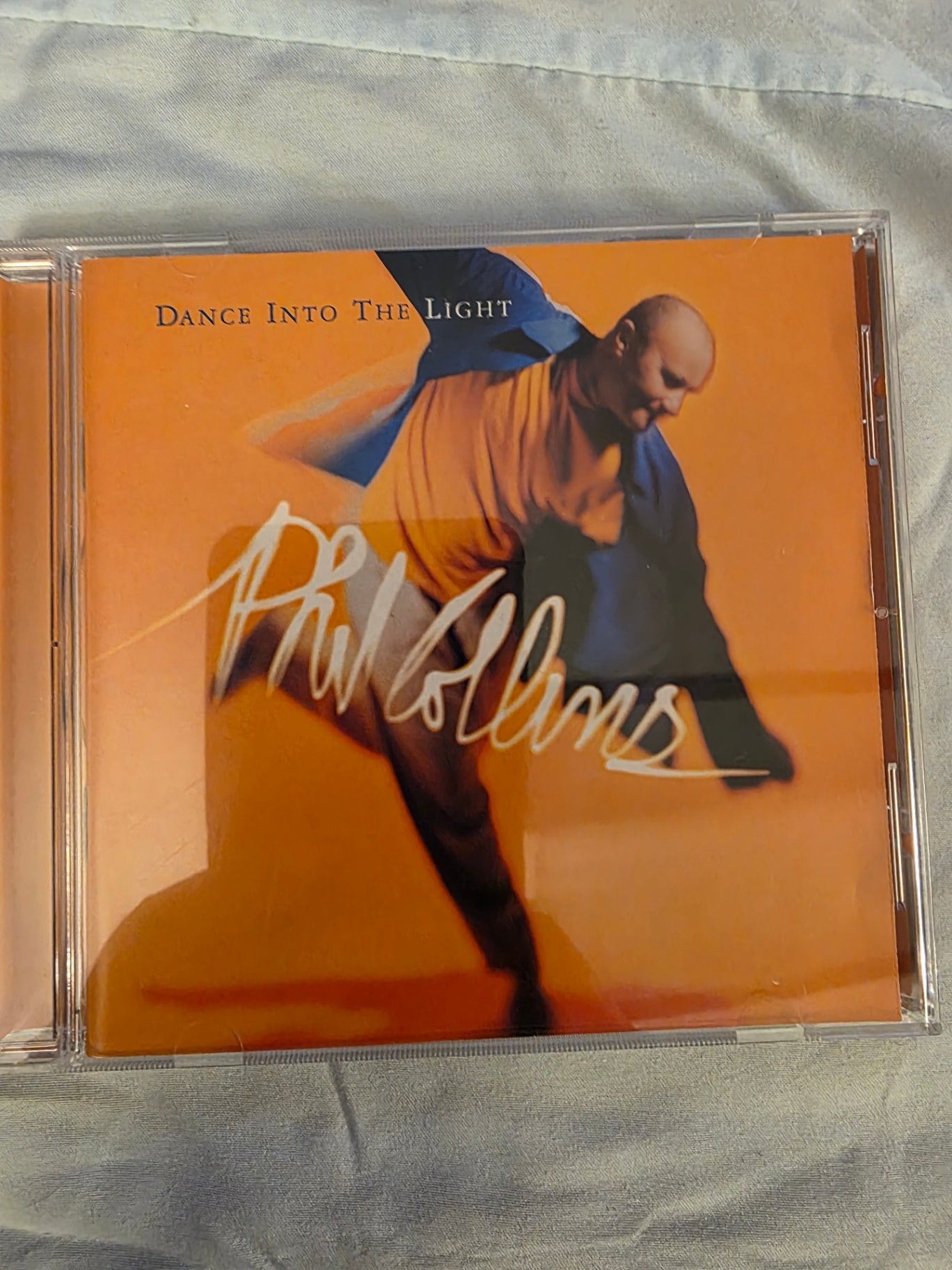 PHIL COLLINS, DANCE INTO THE LIGHT.