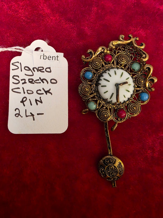 SZECHO CLOCK PIN.