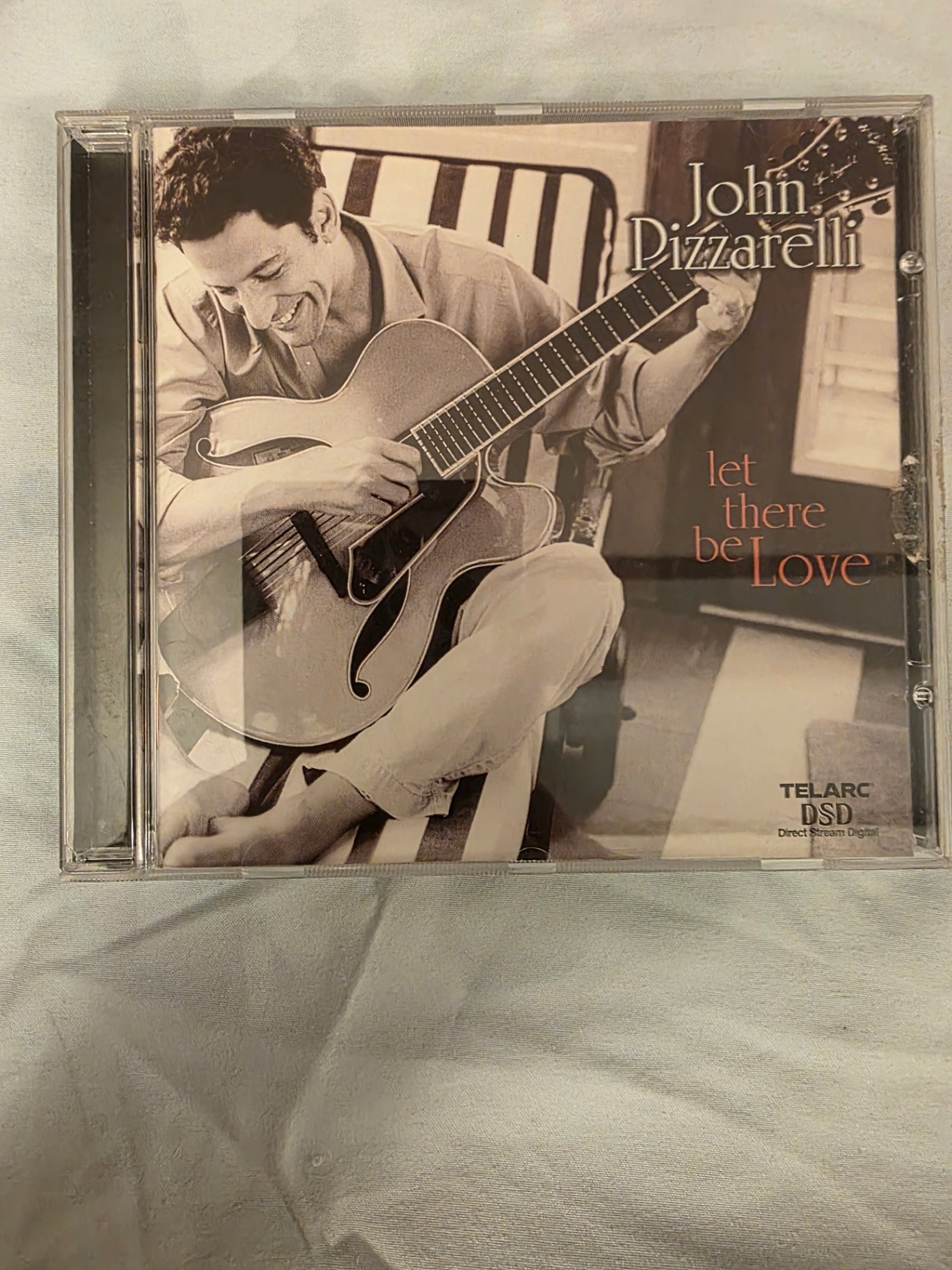 LET THERE BE LOVE BY JOHN PIZZARELLI.