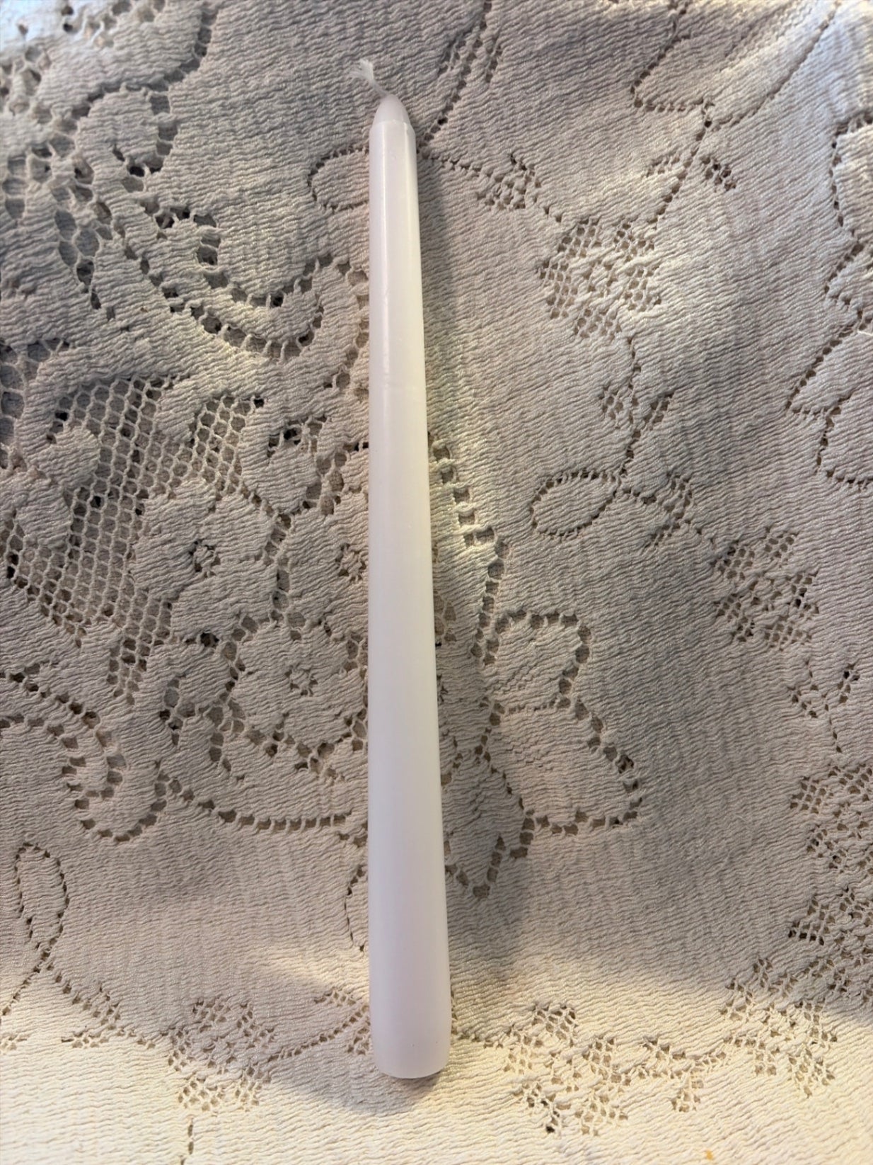 (1) 10” white tapered candle 