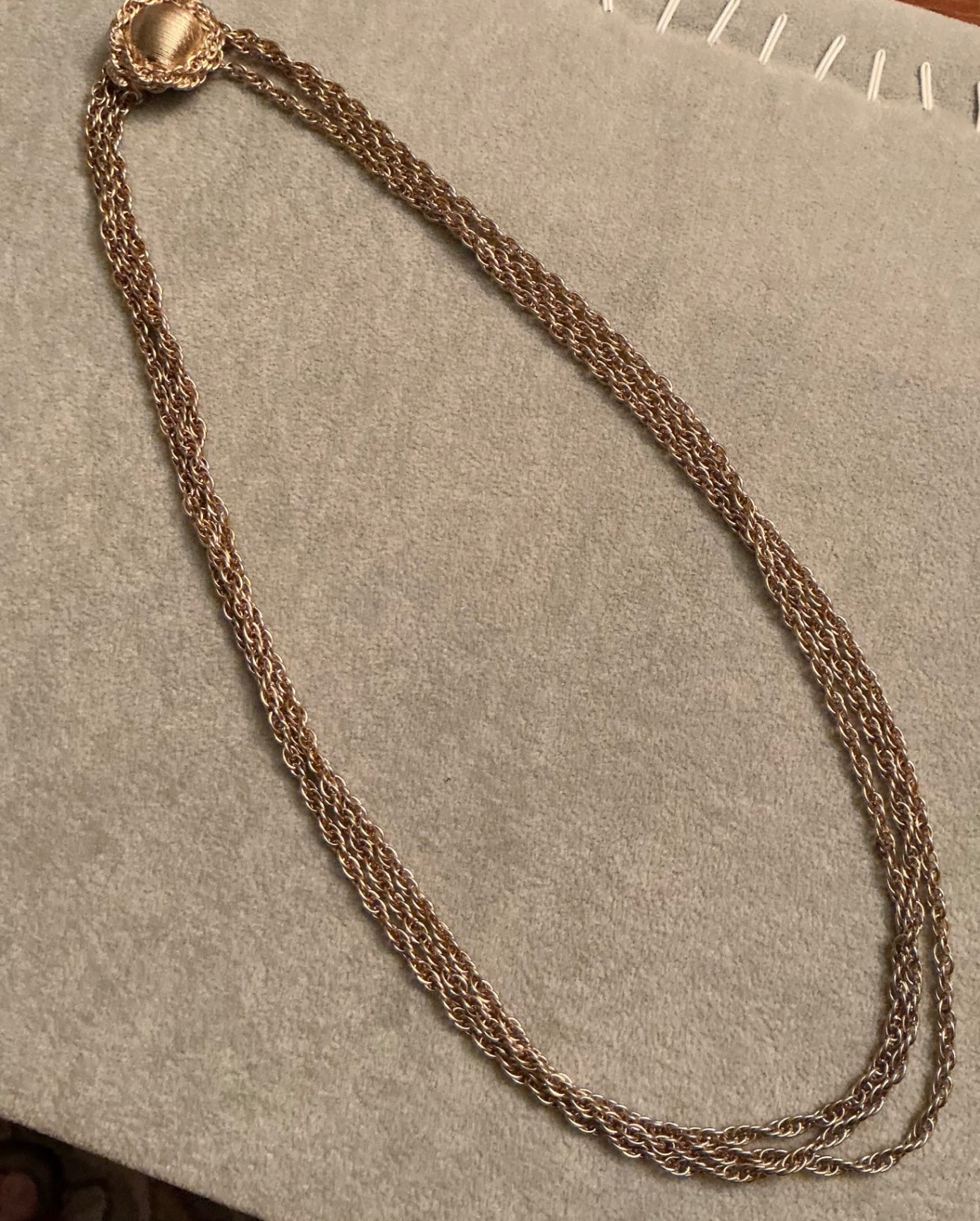 Multi-strand gold tone necklace