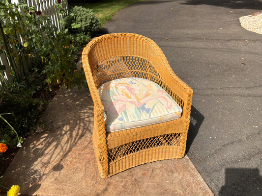 Wicker armchair with cushion