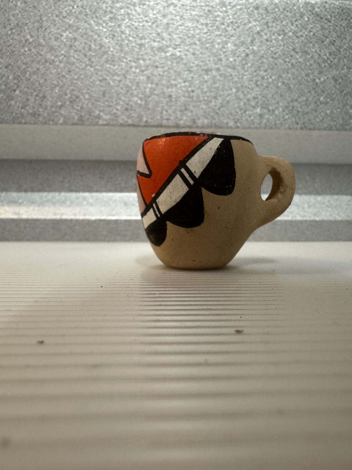 Tiny pottery cup