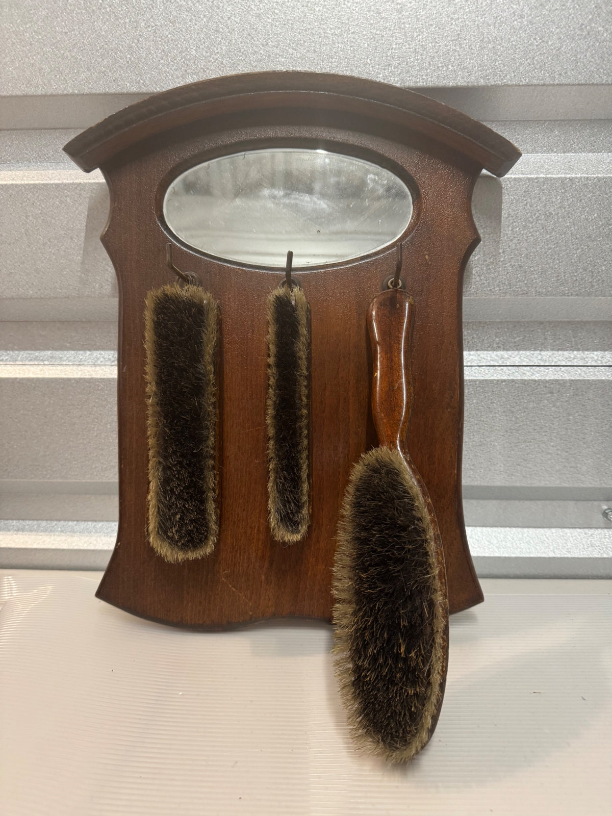 vintage wooden wall-hanging grooming and brush set 