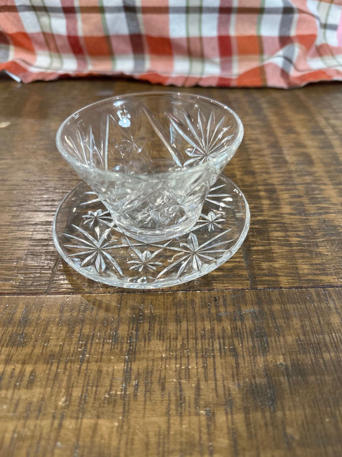 Glass cup and saucer