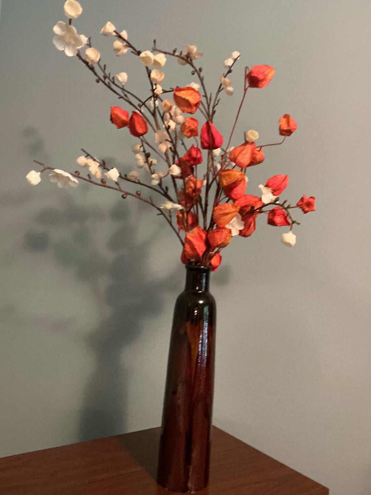 Tall sleek vase w/ florals.