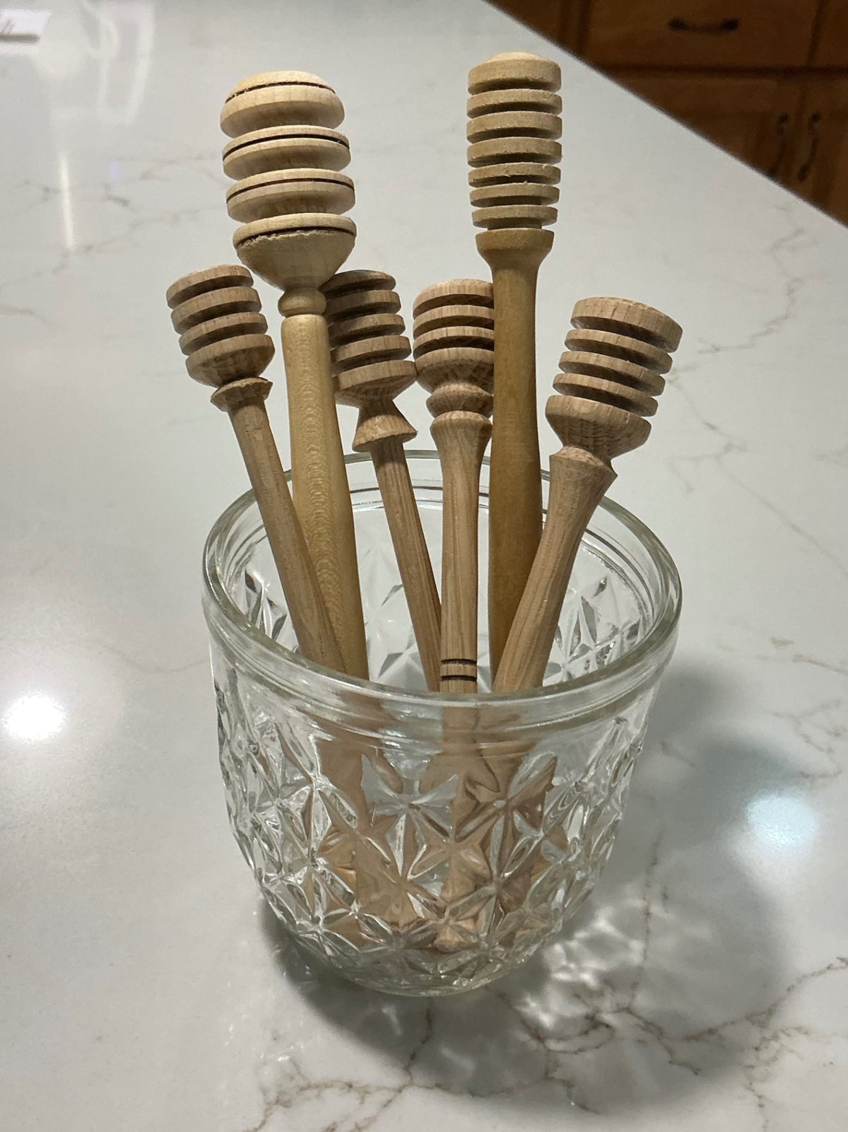 Locally crafted honey dippers.