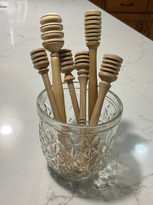 Locally crafted honey dippers.
