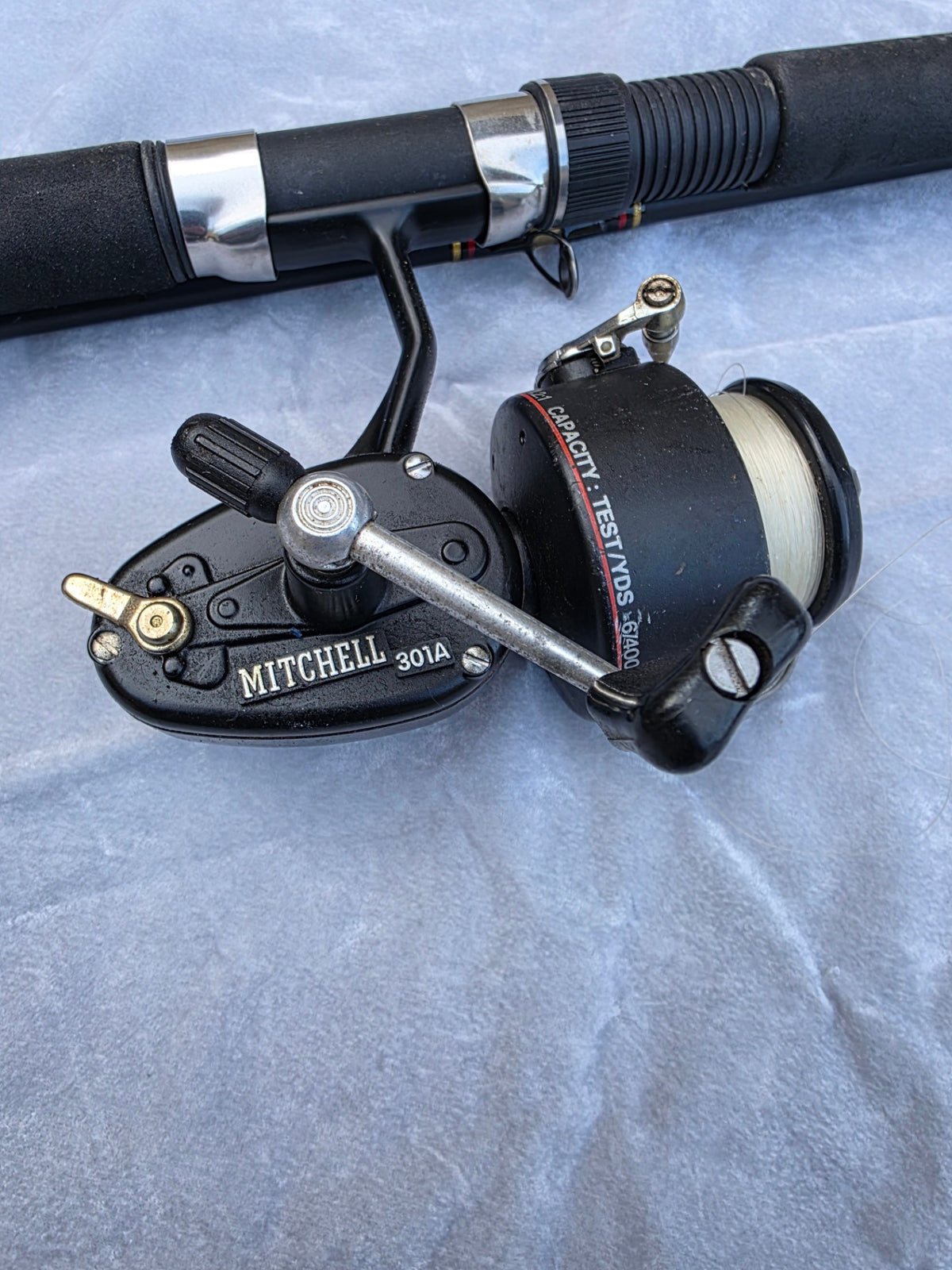 ROD/REEL SPINCAST COMBO WITH A MITCHELL 301 A REEL AND SHAKESPEARE ARSENAL, 8 FT 6 IN ROD.