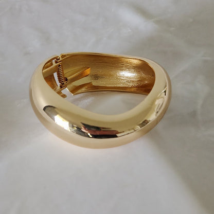 Golden Wave-Form Postmodern Hinged Bangle Bracelet