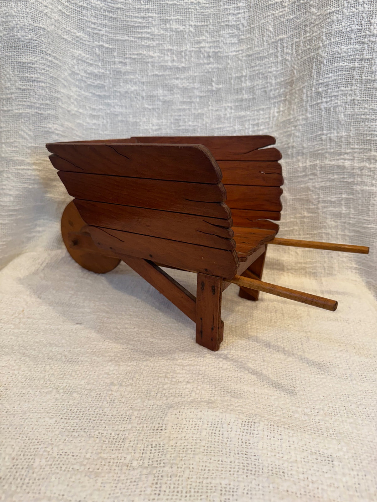 Handcrafted vintage wooden wheelbarrow decor 