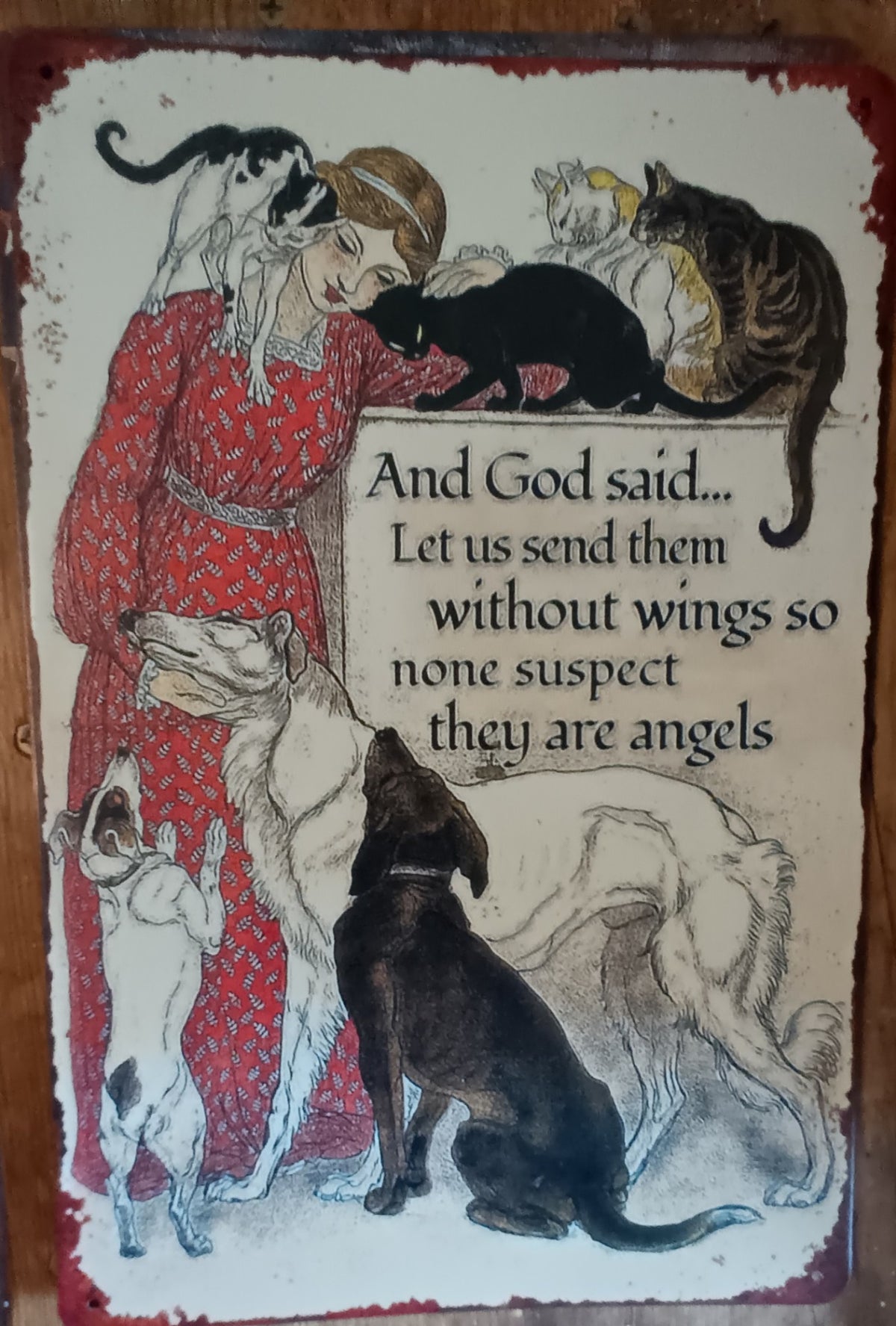Metal Sign Compares Pets to Angels