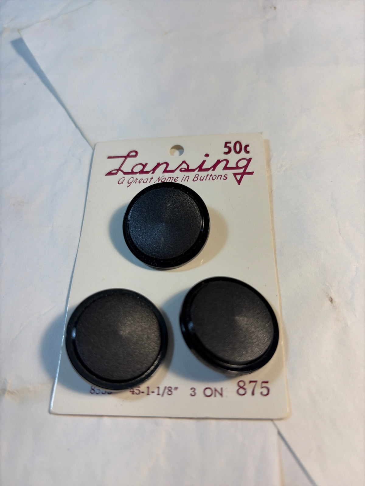 Lansing 1 1/8” black buttons on card 