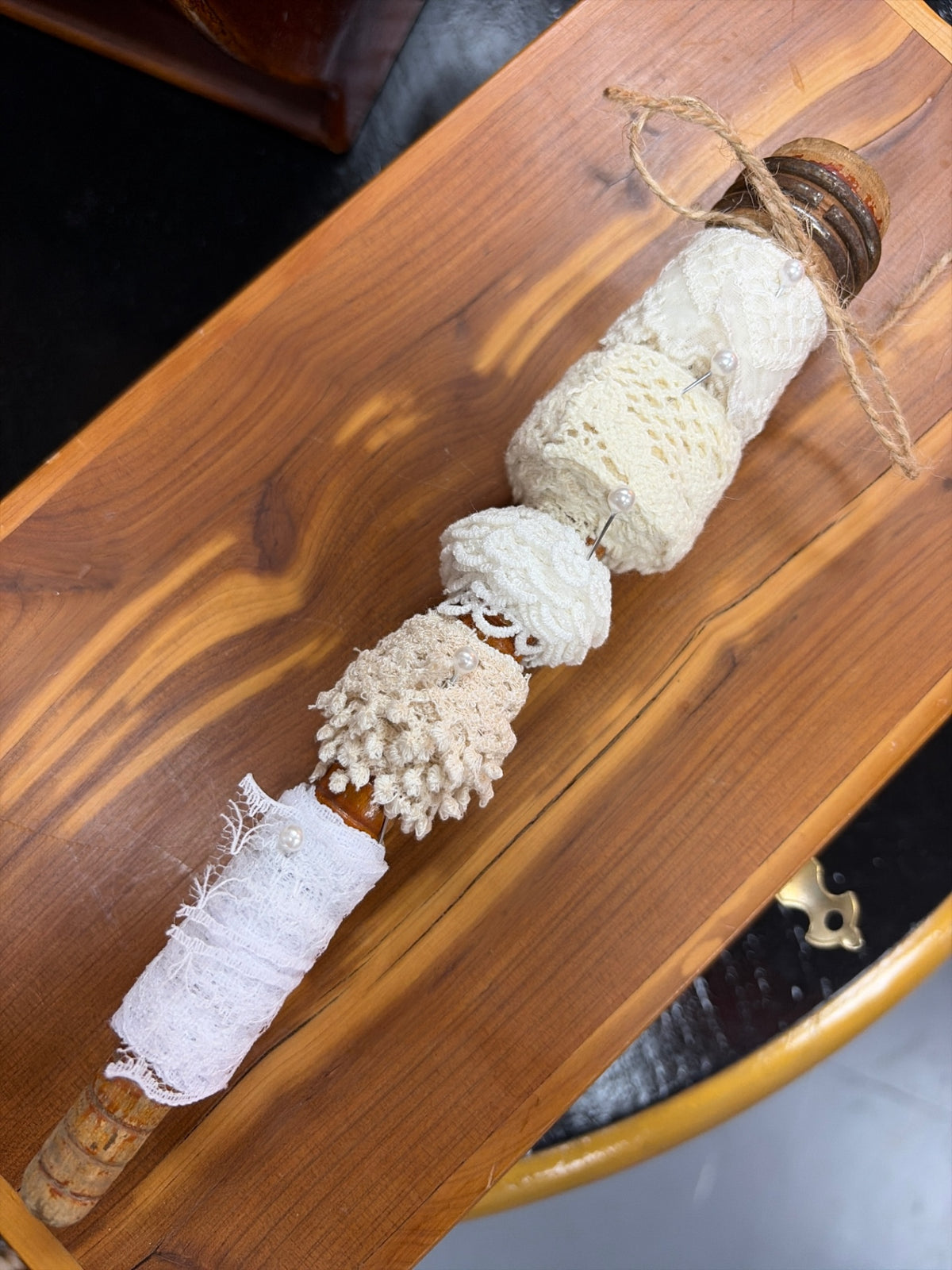 Vintage laces on antic wooden spool