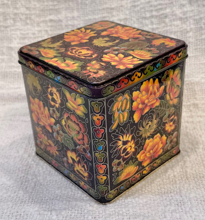 Orange & black vintage floral tin 