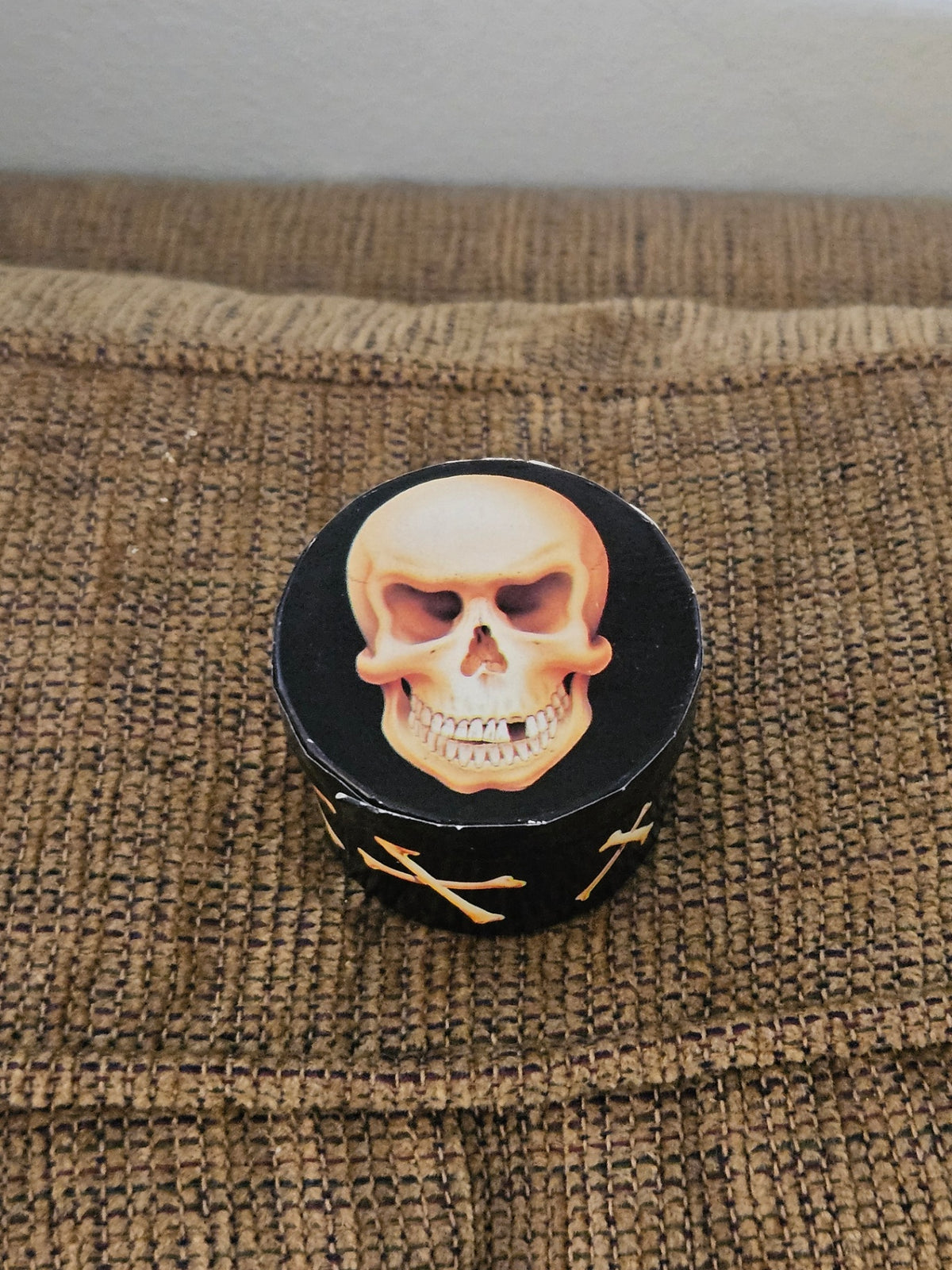 Vint tiny black box w/skull 2 in dia approx