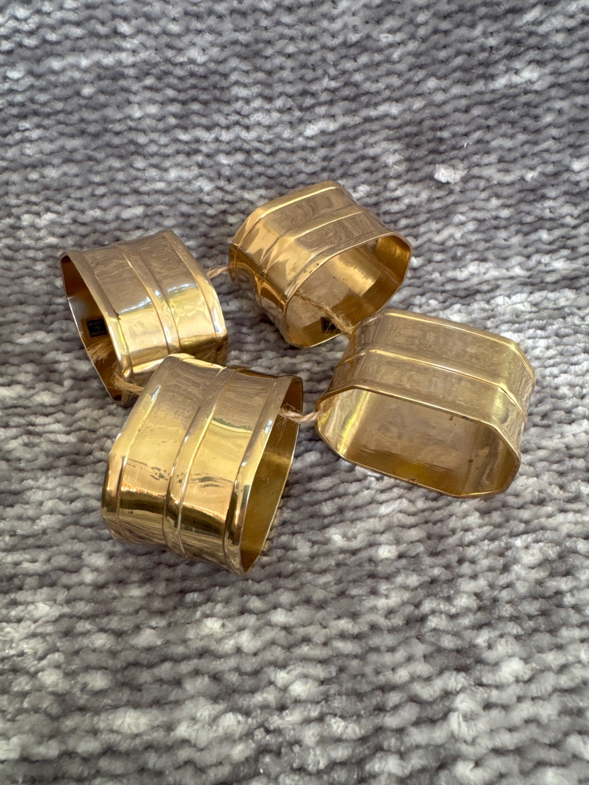 Set of 4 mid century brass octagonal napkin rings