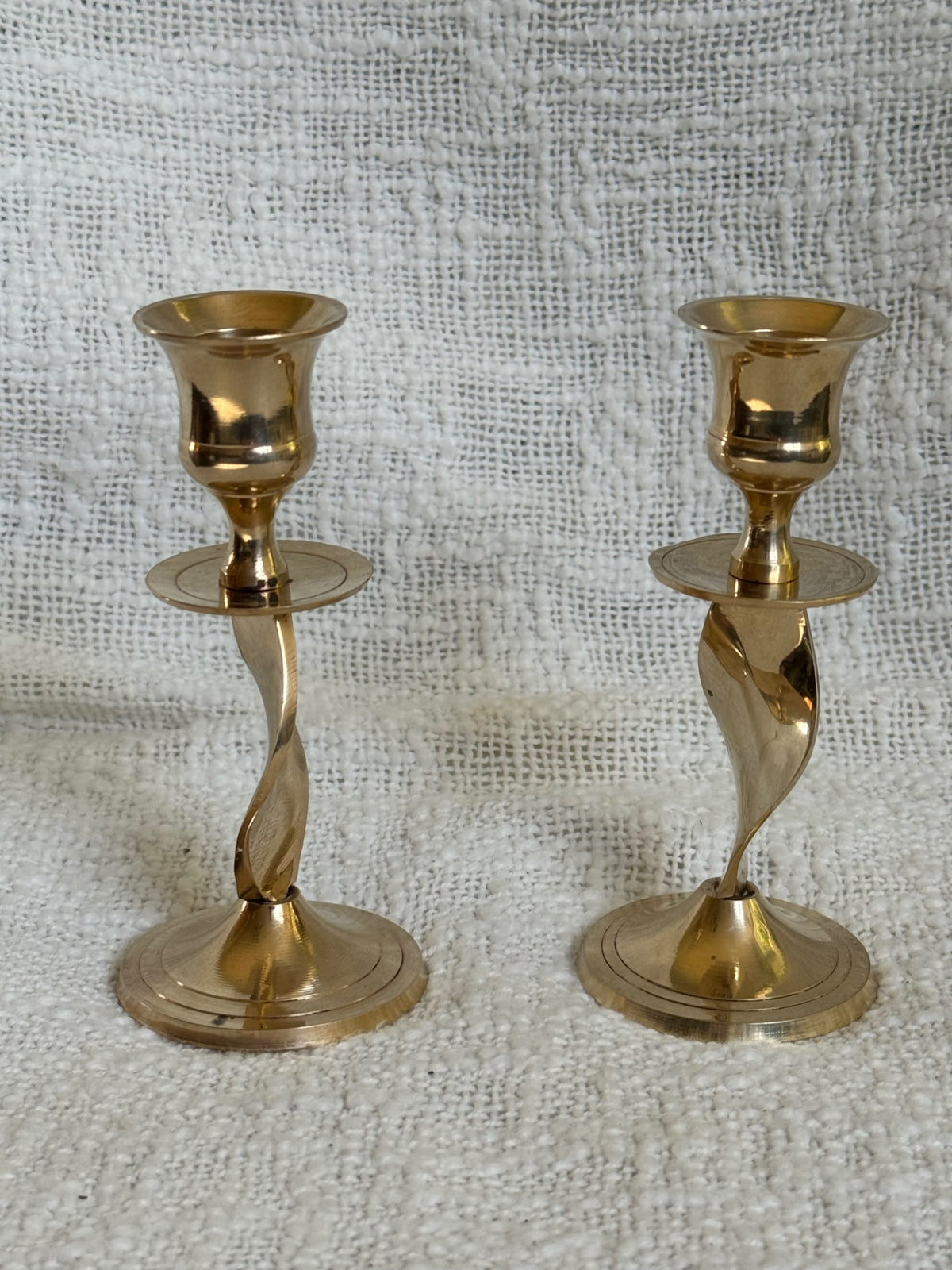 Pair of twisted brass candle sticks 