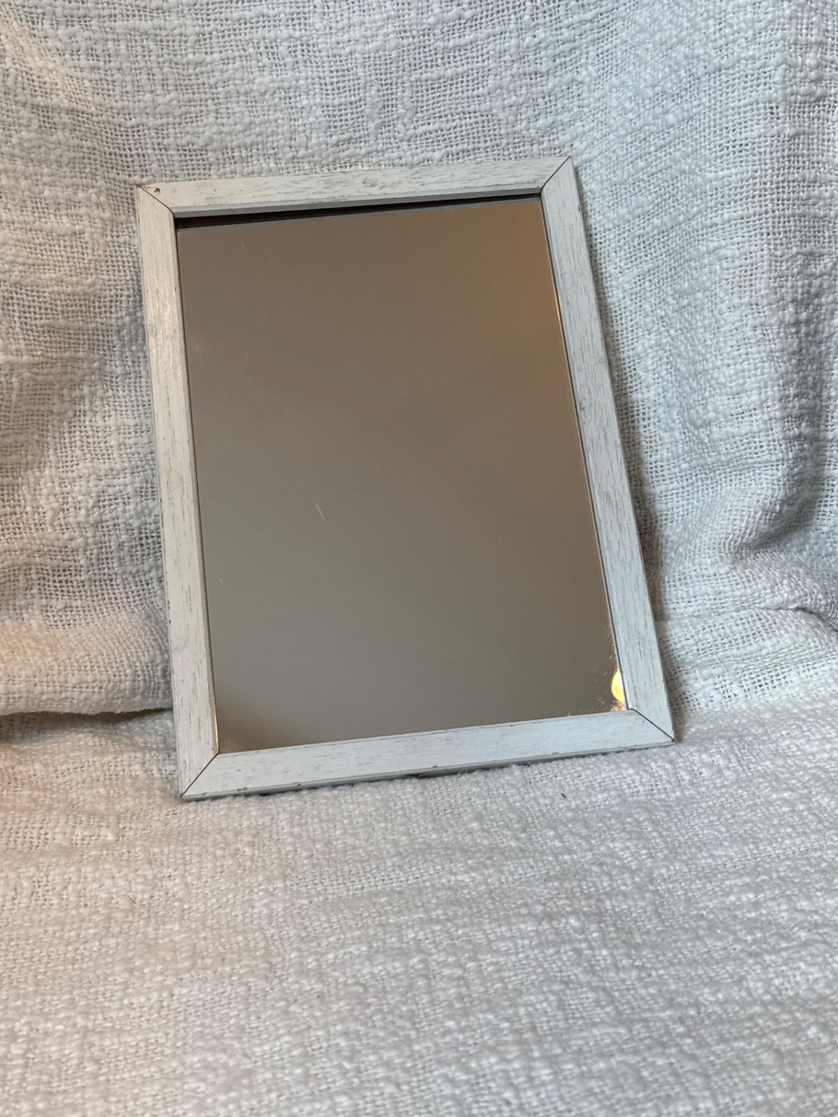 White frame small mirror 